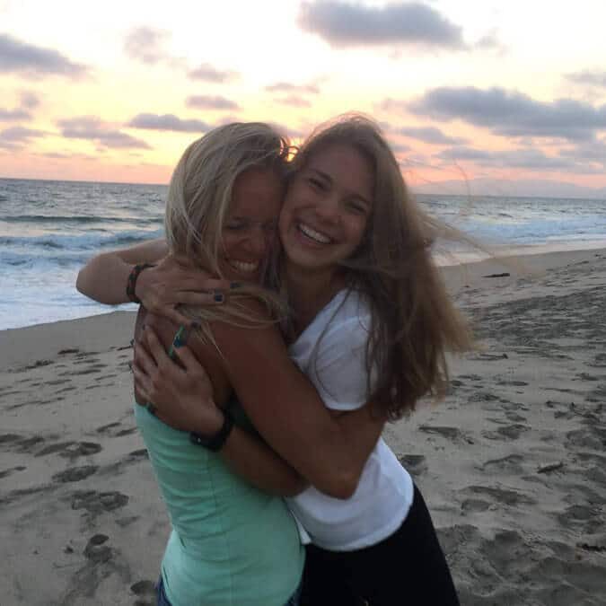 friends on beach at sunset